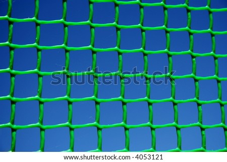 Green net on dark blue sky background 2