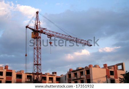 Lifting crane on building of the new house