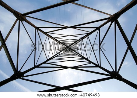 Metal support of an electric transmission line on sky background