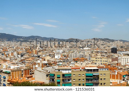 Color DSLR picture of Barcelona, Spain skyline with mountains in background. Horizontal orientation with copy space for text