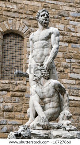 Color DSLR picture of the ancient marble statue of Hercules and Cacus in the Piazza della Signoria, Florence, Italy by the artist Baccio Bandinelli. Plaza is favorite with tourists. Vertical.