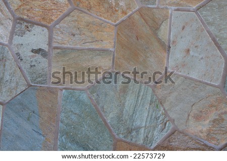Color DSLR abstract image of irregular multi-colored blue stone pavers in a patio. Stones are in many shapes and sizes. Good for background.