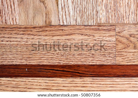 Mixed hardwood flooring, cherry and oak, in horizontal orientation