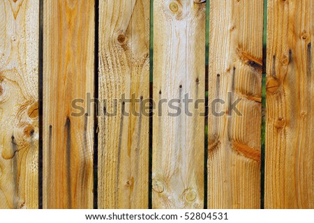 Color DSLR image of Wooden slats in a fence; in horizontal orientation