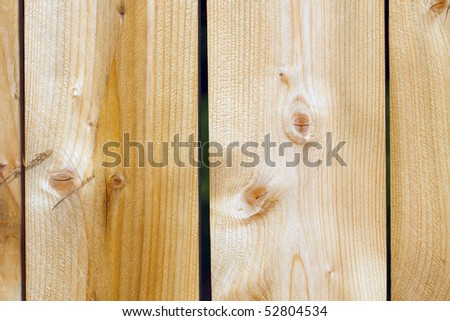 Wooden slats in a fence; in horizontal orientation
