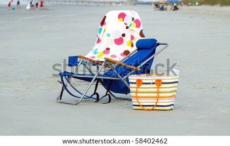 Two folding chairs at the beach; in horizontal orientation