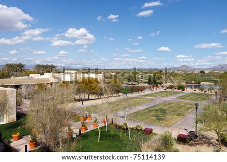 Hotel resort in the Arizona desert desert with a blue sky and mountains in the background