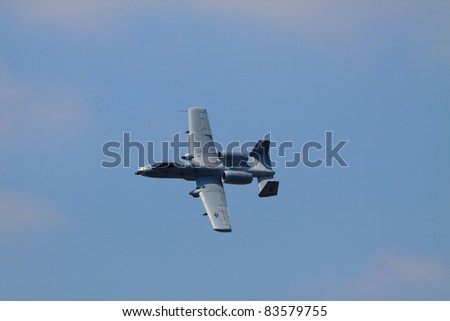 ROCHESTER, NY - JULY 17: United States Air force A-10 Thunderbolt ground attack jet aircraft banking through a turn at an airshow in Rochester, New York on July 17, 2011