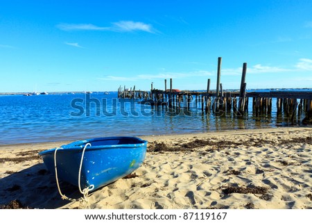 Blue boat on the beach in Provincetown, Massachusetts; in horizontal orientation