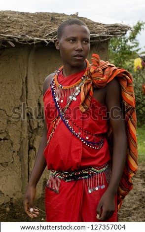 MAASAI MARA, KENYA-DECEMBER 27: Maasai in traditional clothes 27 December, 2012 at Maasai Mara, Kenya. The Maasai are the most famous tribe in Africa.