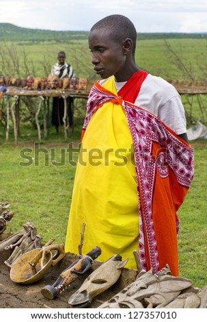 MAASAI MARA, KENYA-DECEMBER 27: Unidentified woman sells traditional souvenirs 27 December, 2012 at Maasai Mara, Kenya. The Maasai are the most famous tribe in Africa.