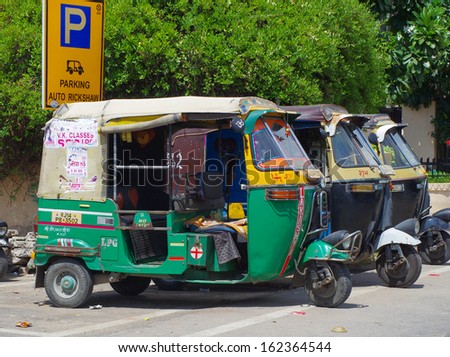 JAIPUR, INDIA - SEPT 26: Auto rickshaw taxi on sept 26, 2013 in Jaipur, India. These taxis are popular type of transport among locals and tourists.
