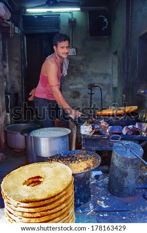 JODHPUR, INDIA - SEPT 20:An unidentified street vendor cooks at a  market Sept 20, 2013 in Jodhpur, Rajastan, India.