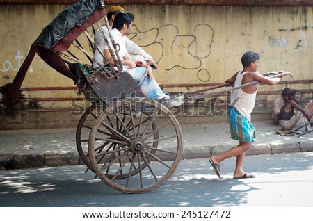 KOLKATA -OCT 06: Traditional hand pulled indian rickshaw driver working on the street on October 10, 2014 in Kolkata, India.