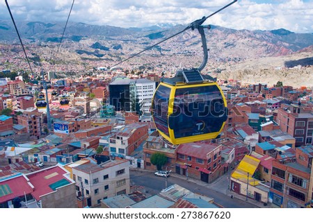 LA PAZ, BOLIVIA - APR 03, 2015: Cable cars carry passengers in La Paz. Aerial cable car of urban transit system opened in 2014 in the Bolivian city of La Paz.