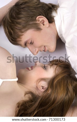 Young cheerful couple touched one another\'s nose