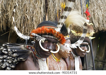 NEW GUINEA, INDONESIA -DECEMBER 28: Unidentified people of a Papuan tribe in traditional clothes and coloring in New Guinea Island, Indonesia on December 28, 2010