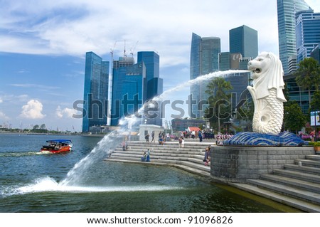 SINGAPORE-AUG.21 The Merlion fountain and Singapore skyline on Aug 21 2011 Merlion is a mythical creature with the head of a lion and the body of a fish and is seen as a symbol of Singapore SINGAPORE-AUG.21 The Merlion fountain and Singapore skyline on Aug 21 2011 Merlion is a mythical creature with the head of a lion and the body of a fish and is seen as a symbol of Singapore