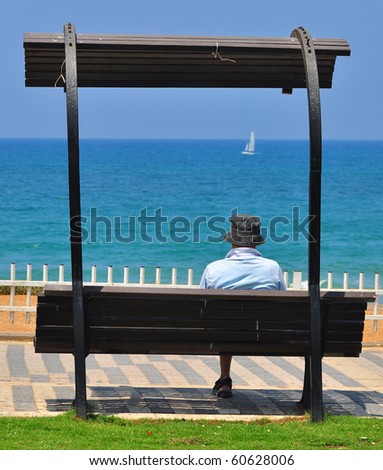 Lonely dreaming man at the Tel Aviv seashore. Israel.