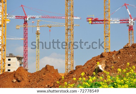 Lifting cranes at new construction site in central Israel.