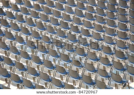 Plastic chairs with metal legs for outdoor performance.