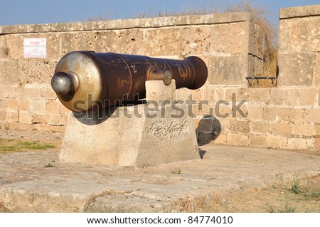 Old gun at the Acre wall. Israel.