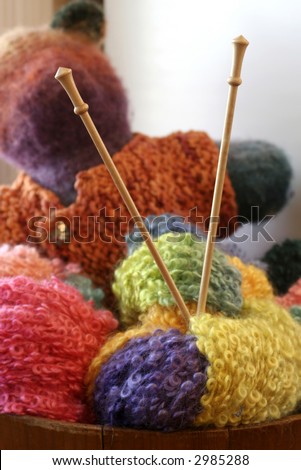 stock photo : knitting needles in balls of yarn