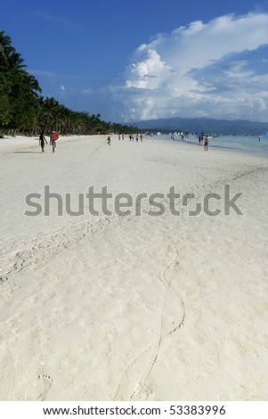 tourists  on white beach on boracay island in the philippines