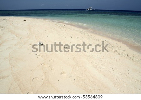 beach on deserted philippine island in the sulu sea