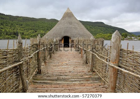 reconstruction of iron age crannog dwelling built over the water of loch tay in perthshire scotland