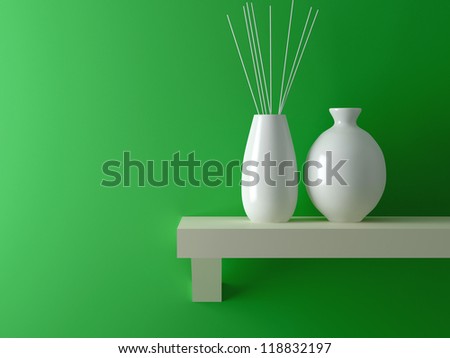 Two white vases on wooden shelf in front of green wall. Interior design.