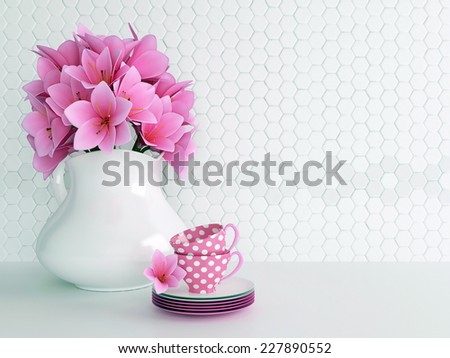 Kitchen still life. Ceramic vase with pink flowers and tea cups on the table.