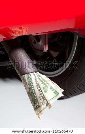Energy crisis and expensive fuel symbolized with euros in a car exhaust pipe