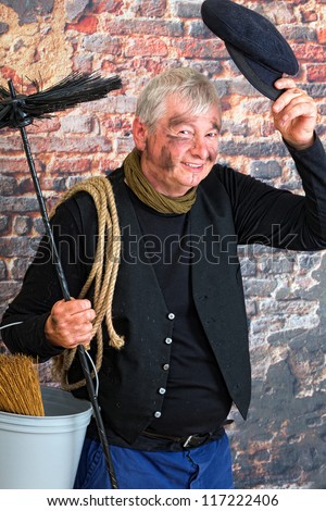 Charming chimney sweep greeting with his cap