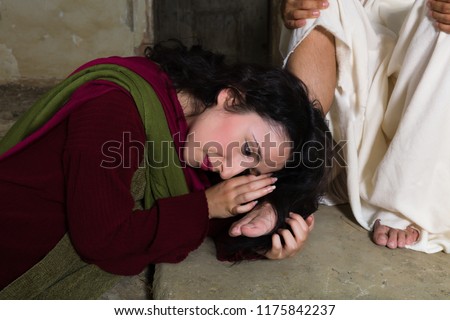 Mary Magdalene crying of shame and embalming Jesus\' feet