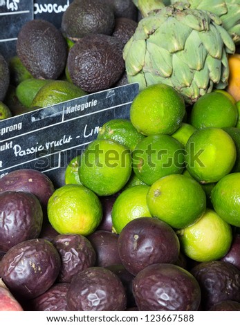 Exotic fruits on display at a greengrocer with european price tags and no brand names