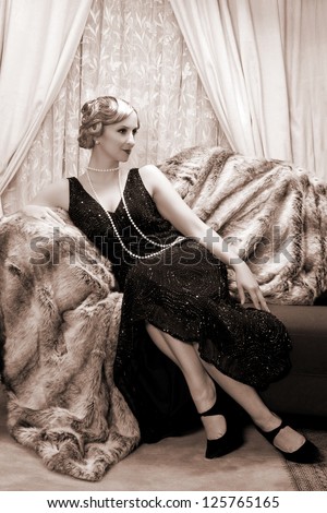 Reenactment of a vintage scene with a lady in the roaring twenties style - stock photo
