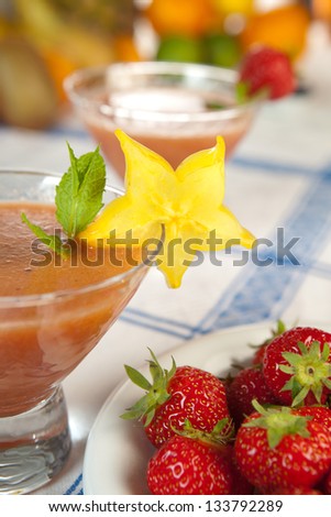 Sliced starfruit used to decorate a summer smoothie