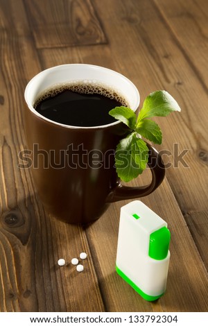 Mug of coffee with stevia tablets as natural and healthy sweetener