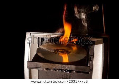 CD drive of a computer on fire and melting