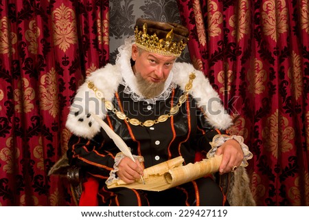 stock-photo-old-king-signing-a-new-law-with-a-feather-quill-229427119.jpg