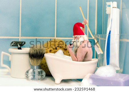 Funny old gnome taking a bath in a soap dish