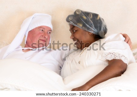 Funny photo of a vintage happy couple in bed