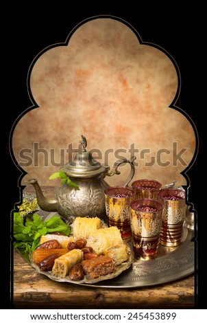 Display of oriental cookies and iftar dates on a Moroccan tea tray