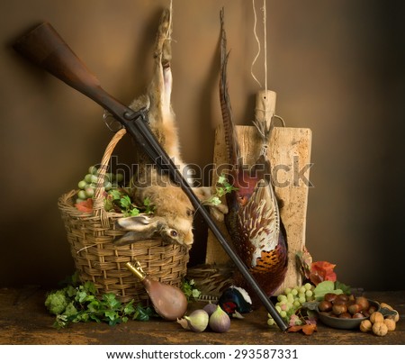 Autumn still life with hunting rifle, pheasant and hare