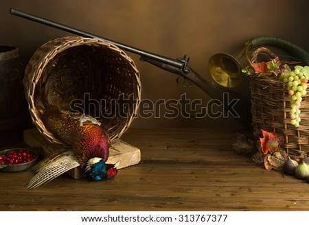 Hunting still life with pheasant, basket and fruit