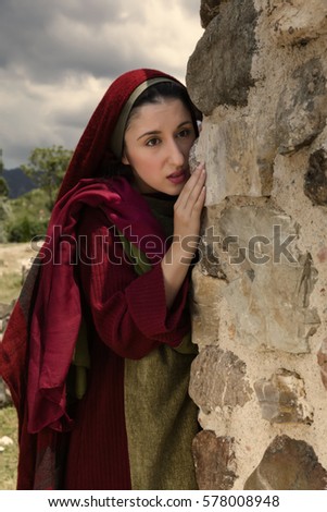 Mary Magdalene standing at the entrance of the empty tomb of Jesus on Easter morning