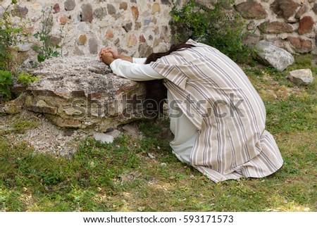 Jesus in agony praying in the garden of olives before his crucifixion