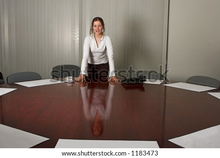 Woman in meeting room, preparing a presentation