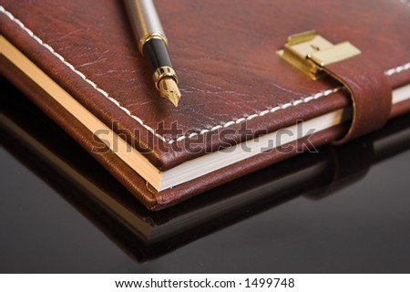 Pen on a closed personal diary